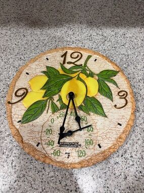 Taylor Springfield Lemons Clock and Thermometer features a vibrant lemon design